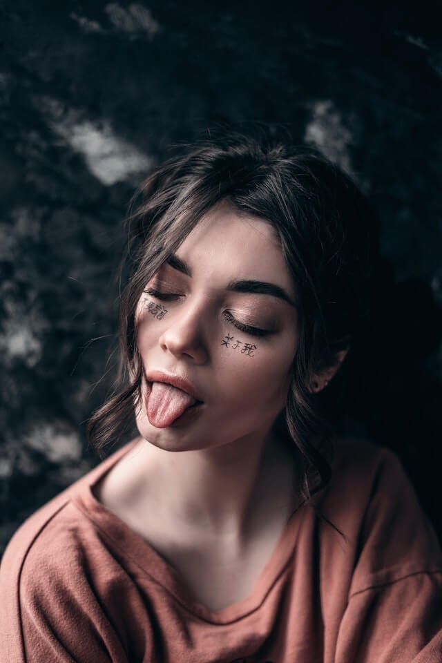 Girl exhibits a tongue