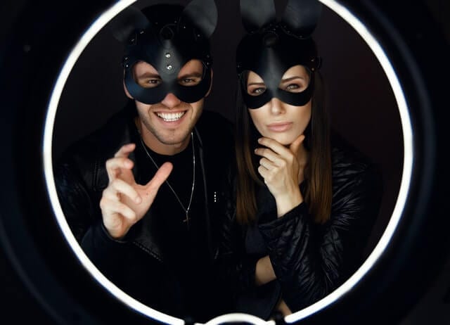 Fetish couple in black mask