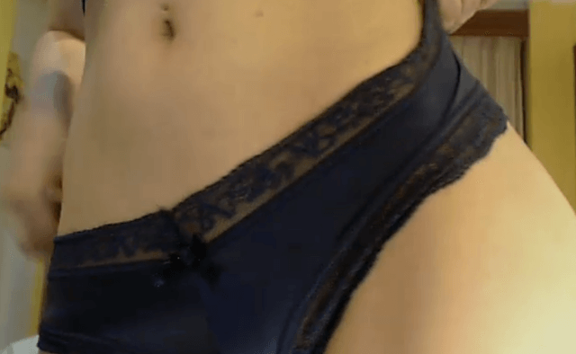 Girl in black panties shows belly